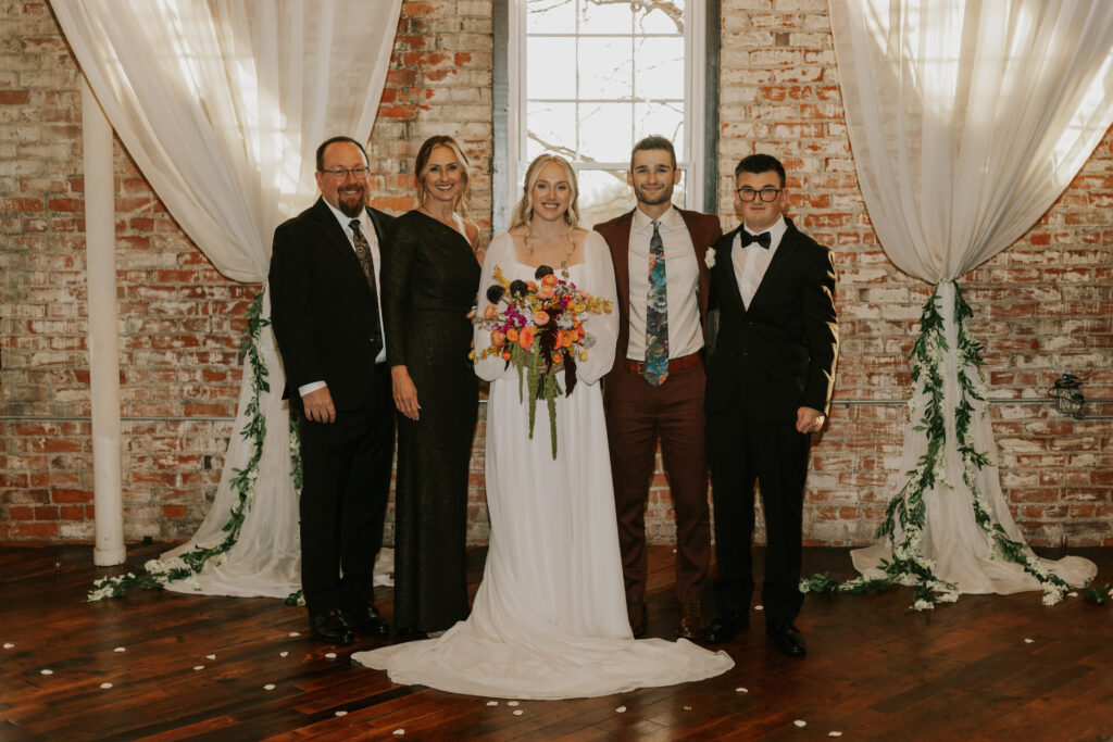wedding family pictures in brick historical building
