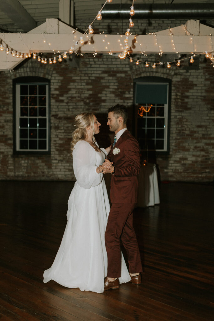 coordinated first dance of bride and groom at wedding reception 