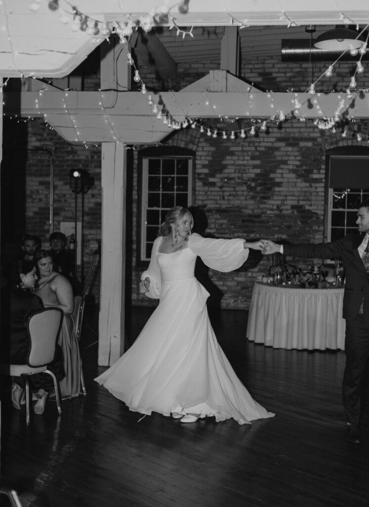 coordinated first dance of bride and groom at wedding reception 