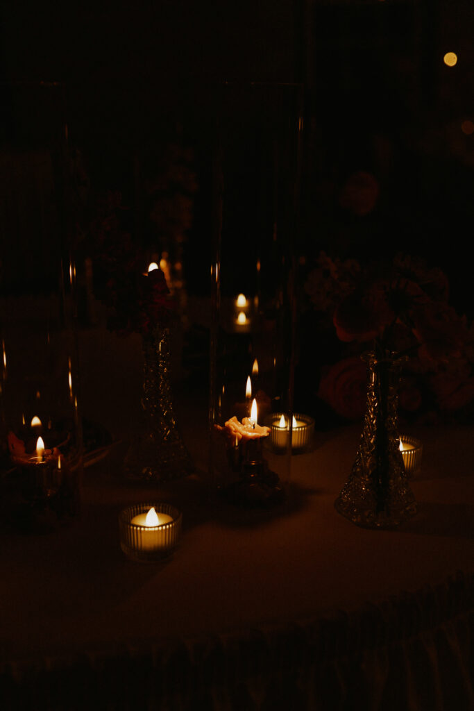 unique lighting at wedding reception with candle light on tables