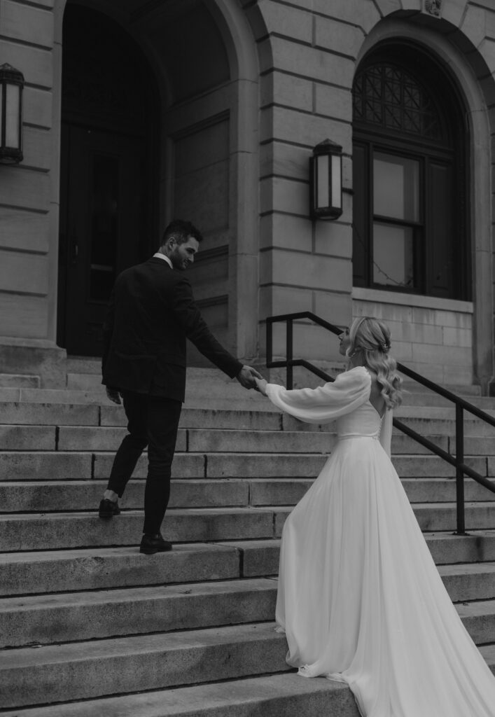 bride and groom portraits at Goshen, Indiana courthouse downtown Goshen on steps