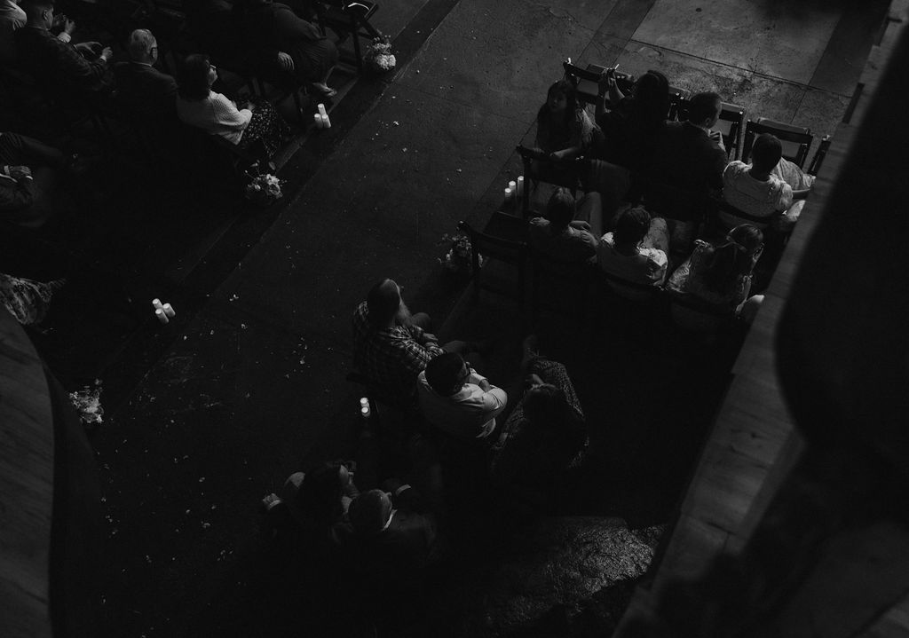 Guests sitting at ceremony location in the North Church Venue in Muncie, Indiana waiting for bride and groom.