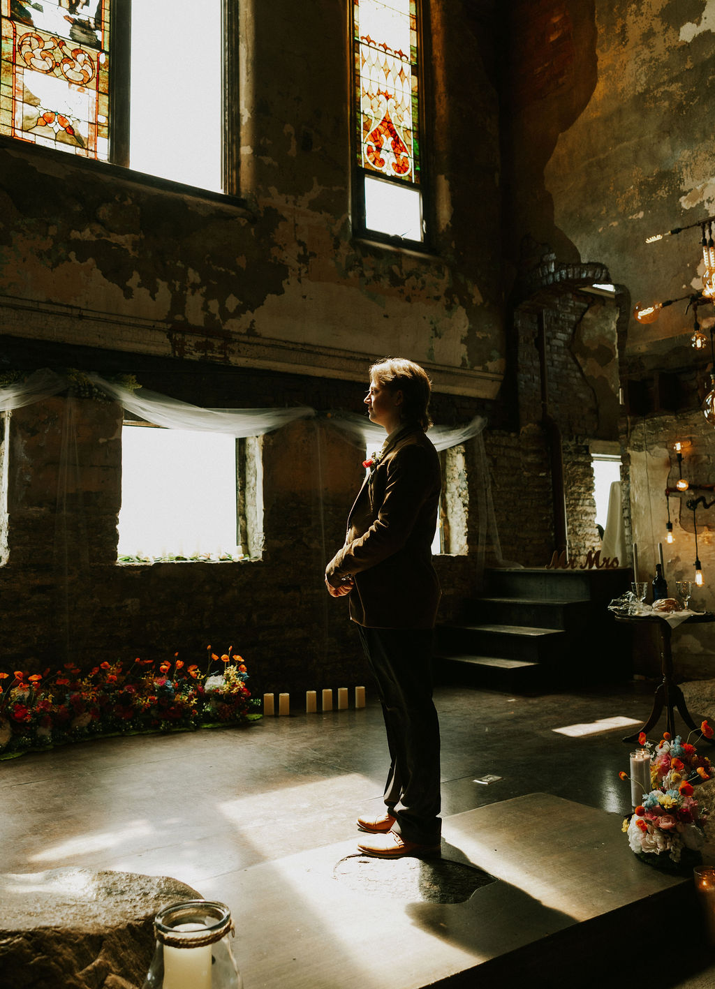Groom portrait in a brown suit at The North Church Venue in Muncie, Indiana