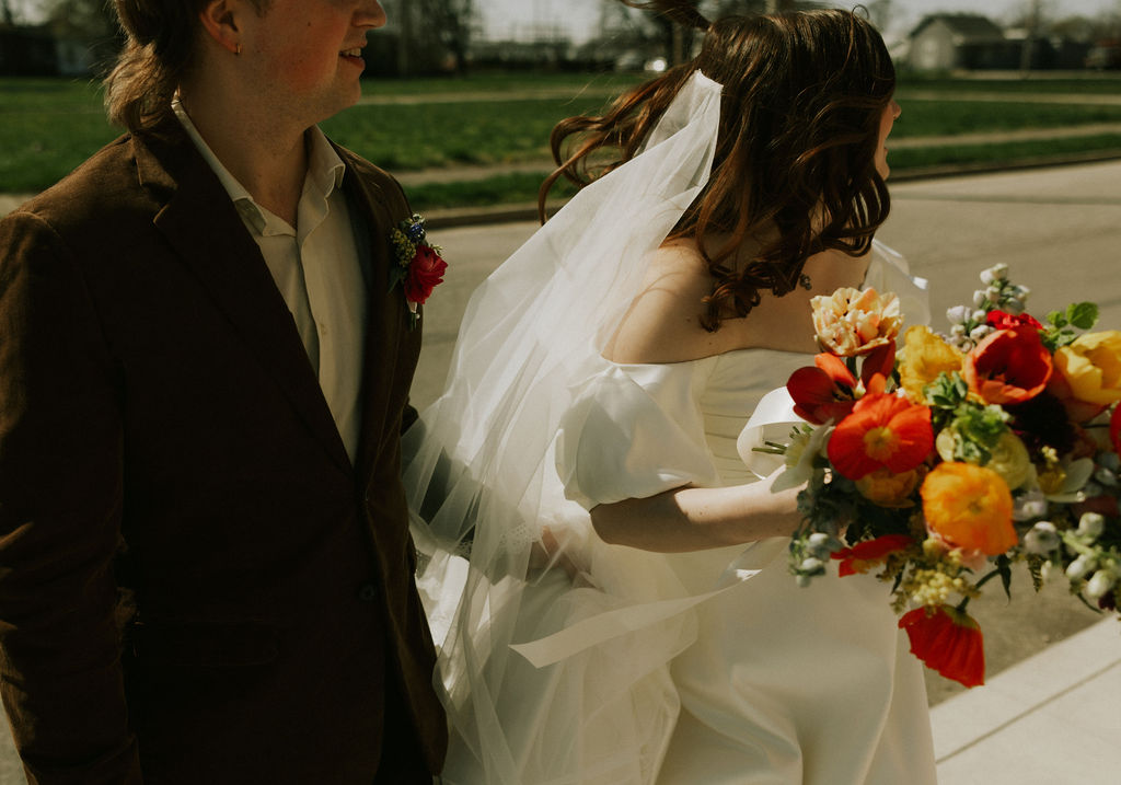 Bride and grooms artistic portraits at historic Muncie, Indiana in North Church Venue.