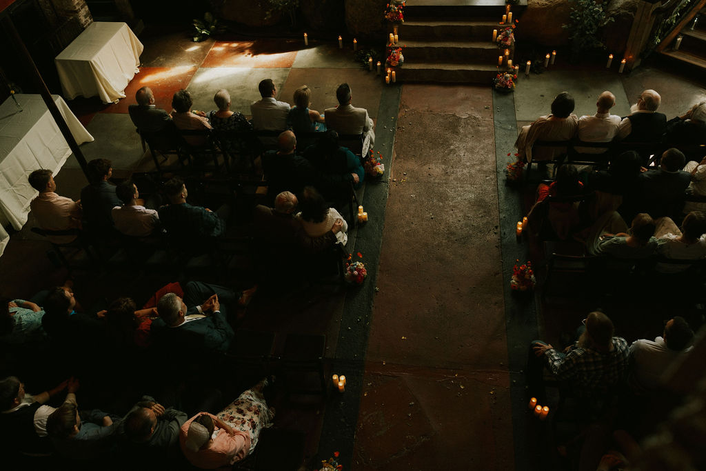 Guests sitting at wedding ceremony in muncie, indiana at north church venue.