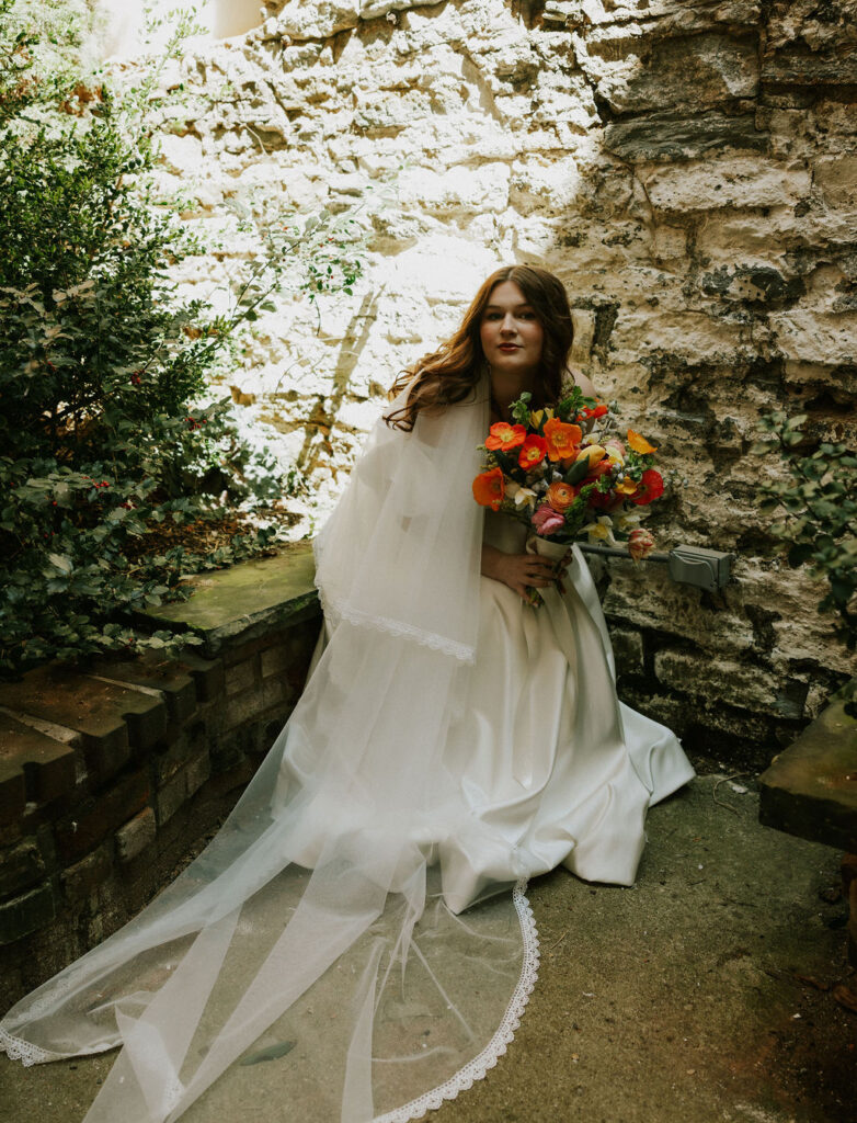 Bride Portrait in satin wedding dress at the altar steps in The North Church Venue in Muncie, Indiana