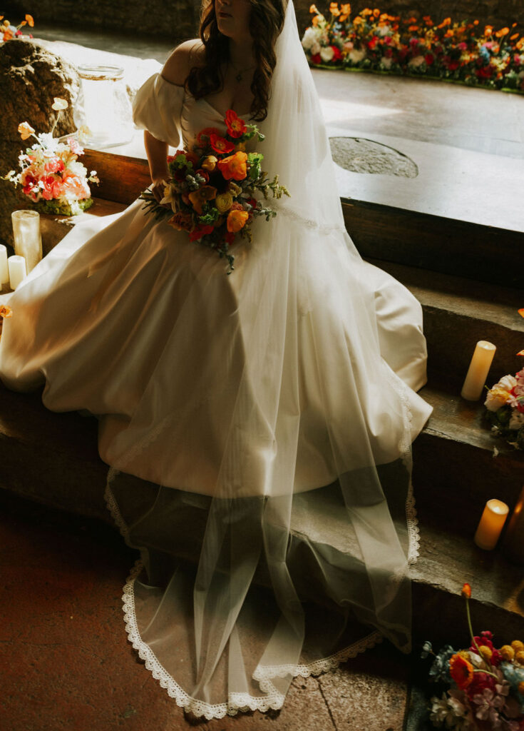 Bride Portrait in satin wedding dress at the altar steps in The North Church Venue in Muncie, Indiana