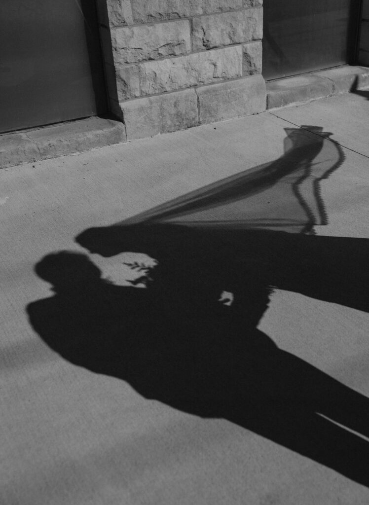 Bride and grooms artistic portraits shadows at Muncie, Indiana in North Church Venue.