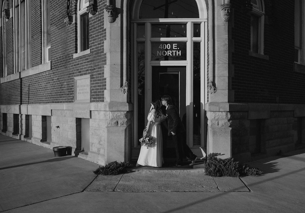 Bride and groom portraits in front of historic The North Church Venue in Muncie, Indiana