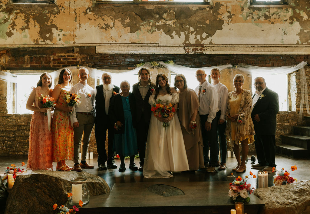 Family portraits with bride and groom at wedding in muncie, indiana at North Church Venue