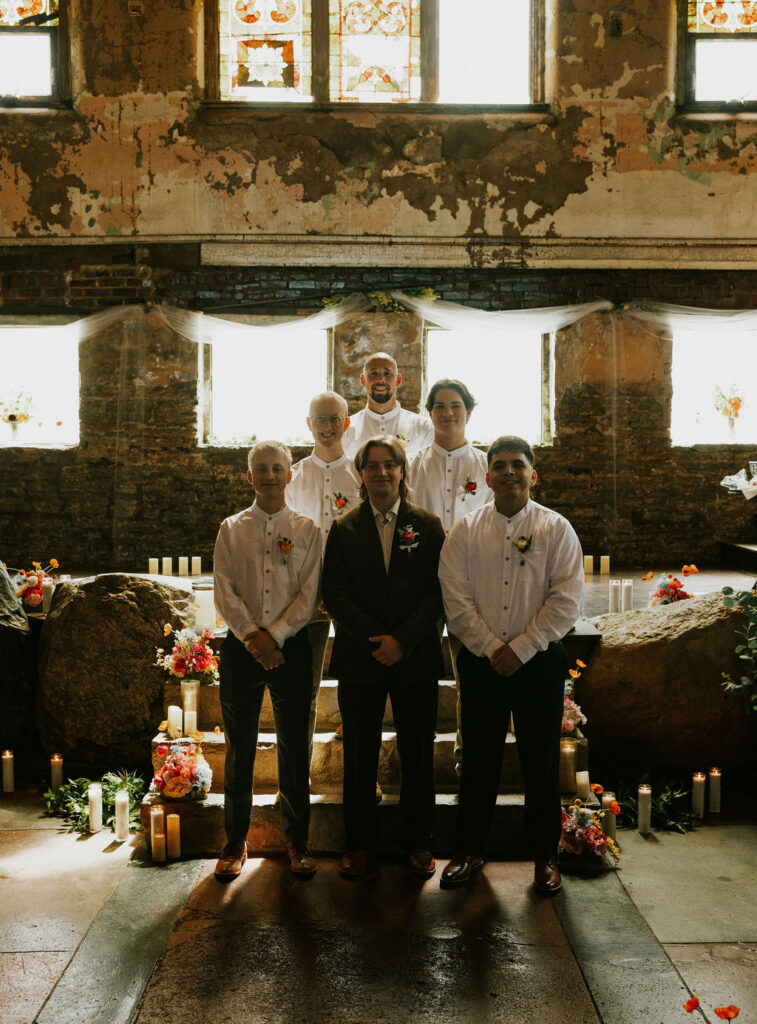 Nontraditional groomsmen portraits with groom at wedding in Muncie, Indiana at the North Church Wedding Venue.