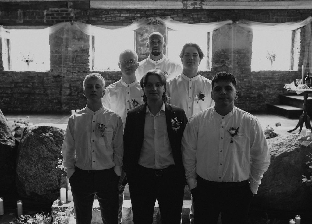 Nontraditional groomsmen portraits with groom at wedding in Muncie, Indiana at the North Church Wedding Venue.