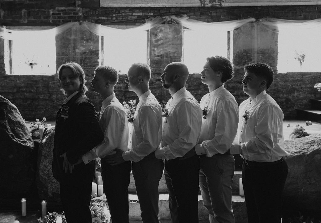 Nontraditional groomsmen portraits with groom at wedding in Muncie, Indiana at the North Church Wedding Venue.