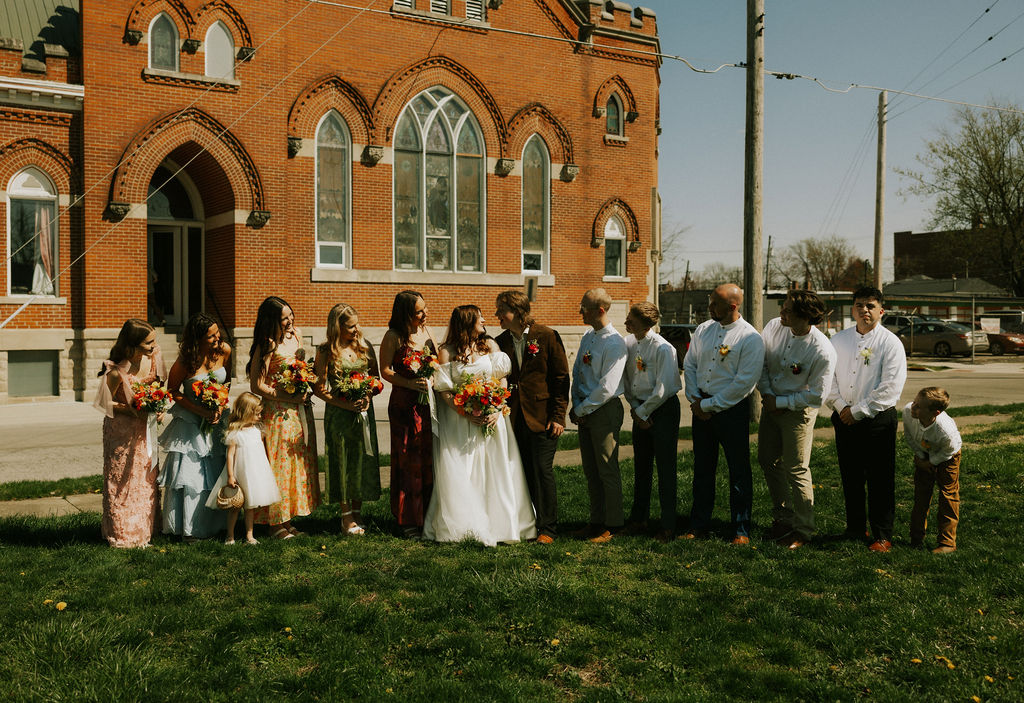 Wedding party with bride and groom portraits at Muncie, Indiana at The North Church Venue.