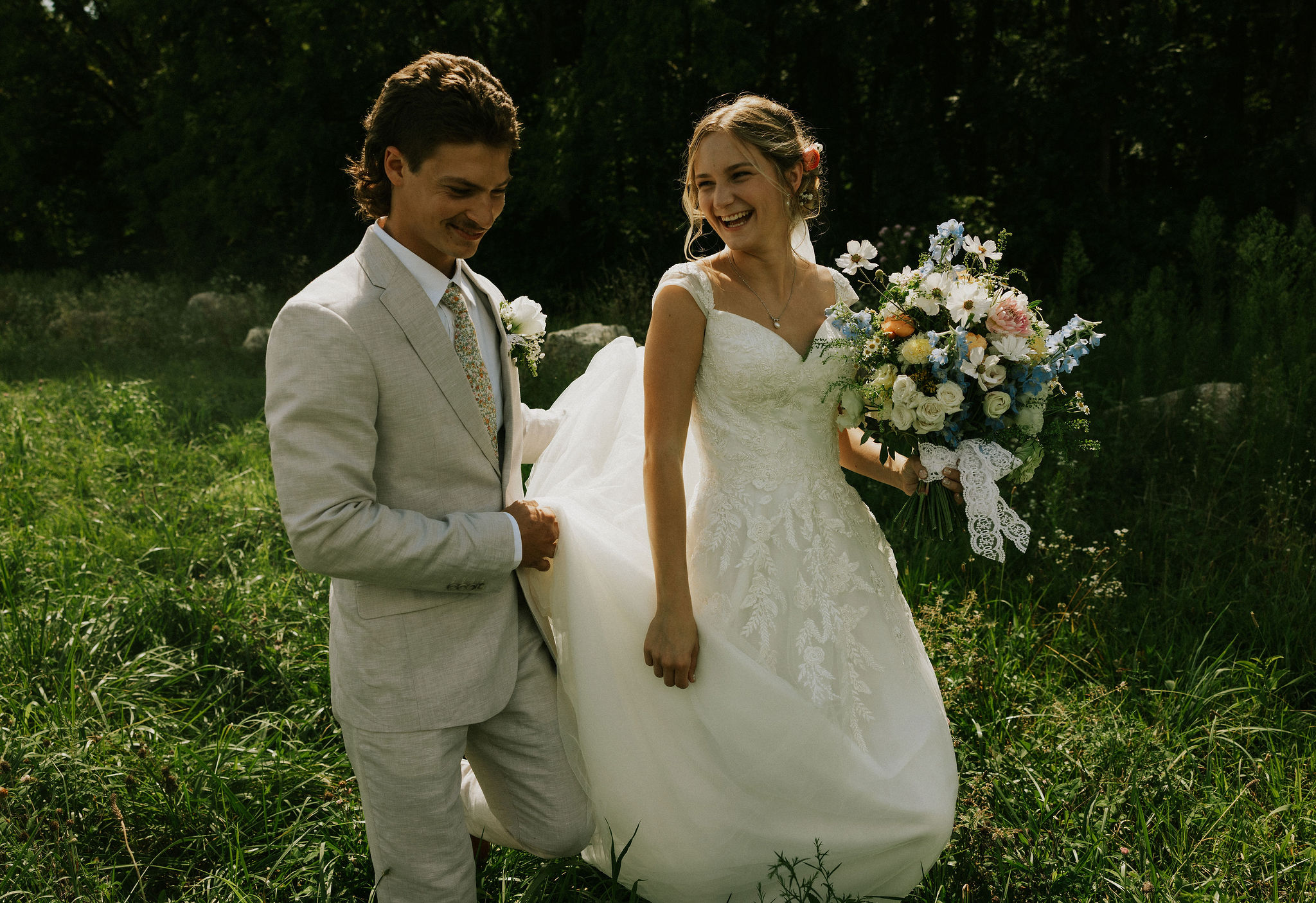 Bride and groom walking together at their wedding in Goshen, Indiana.