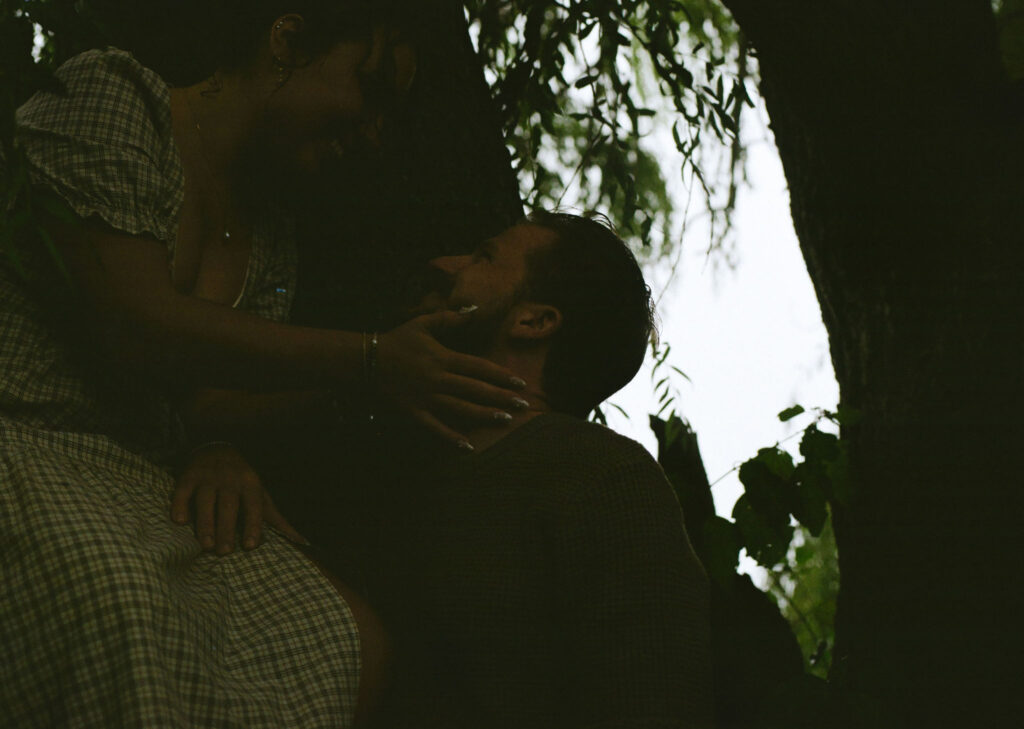 Couple getting engaged on Mackinac Island, Michigan taking couples pictures.