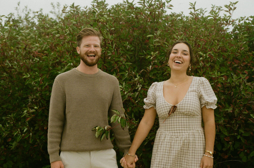 Couple getting engaged on Mackinac Island, Michigan taking couples pictures on 35mm film.