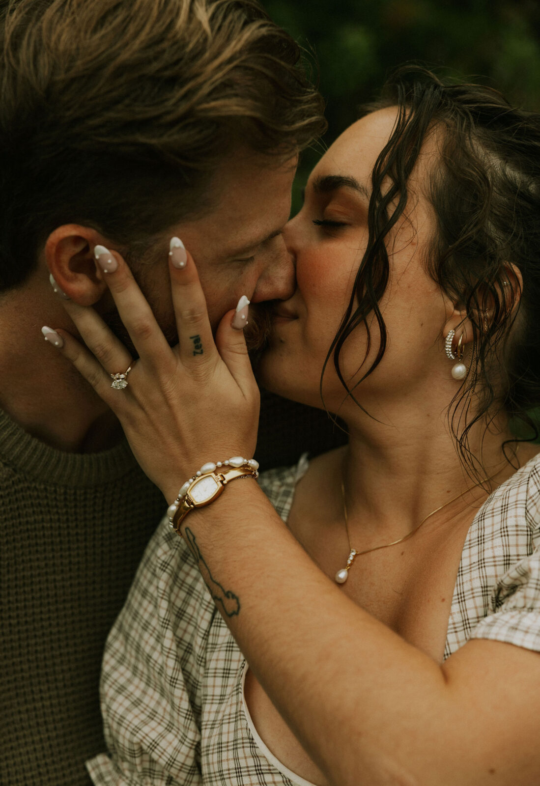 Couple getting engaged on Mackinac Island, Michigan on the beach.
