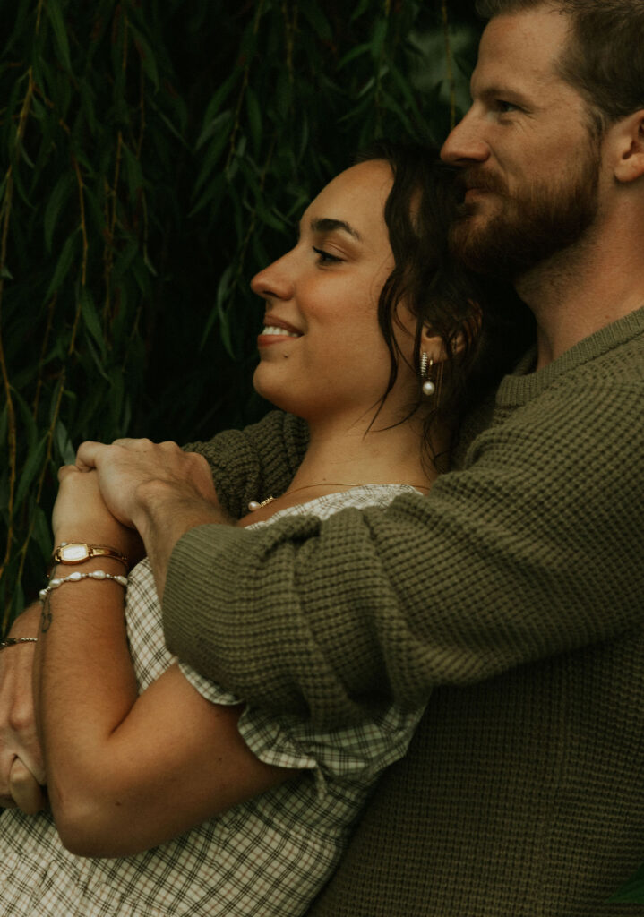 Couple getting engaged on Mackinac Island, Michigan taking couples pictures.