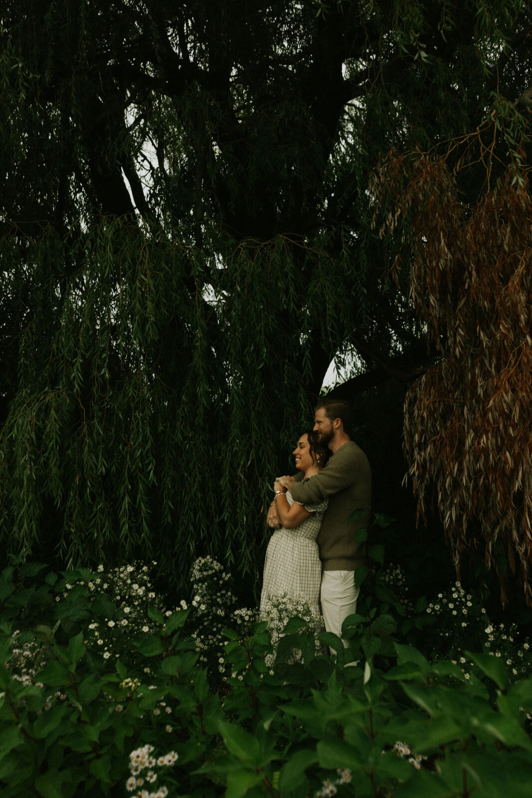 Couple getting engaged on Mackinac Island, Michigan taking couples pictures.
