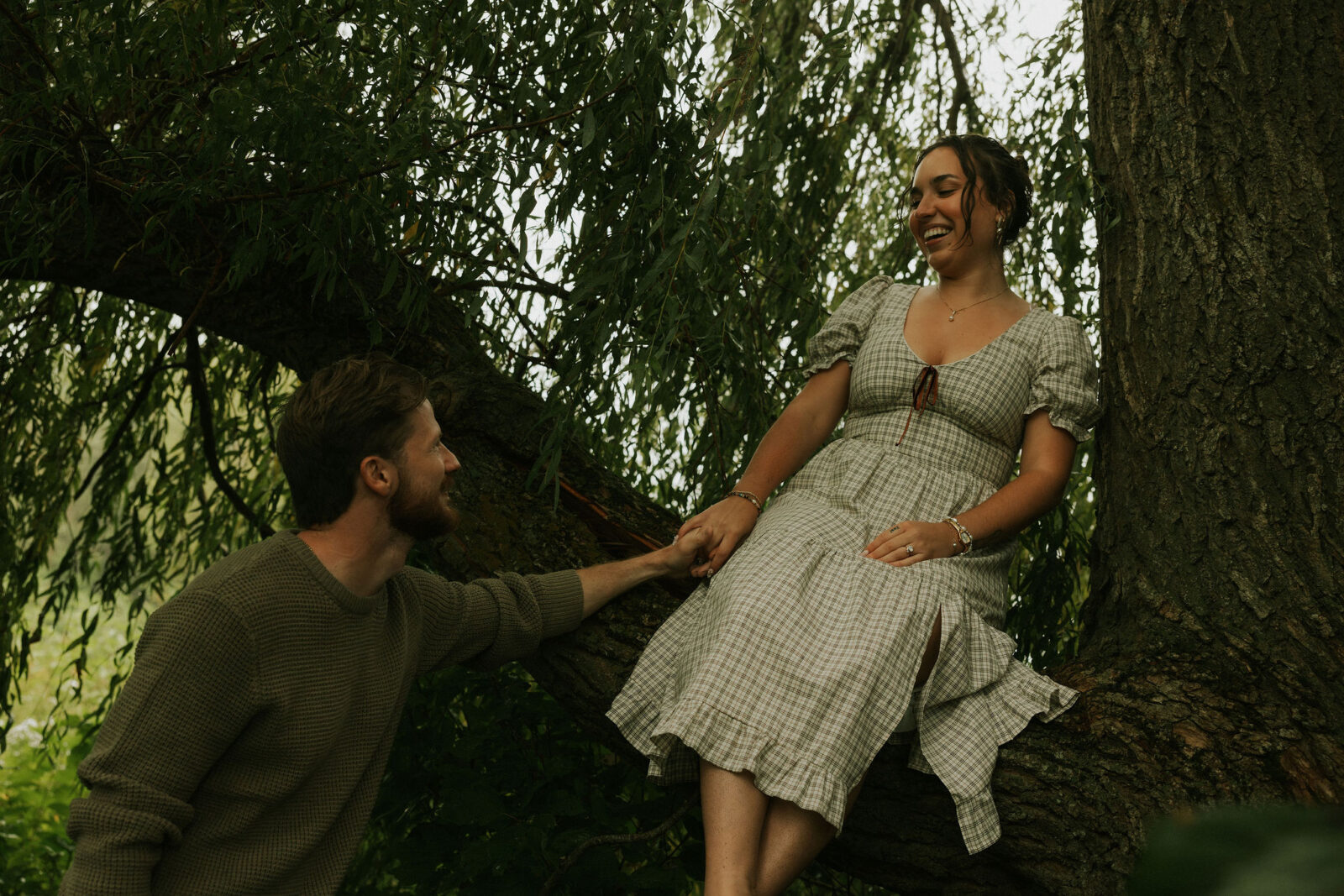 Couple getting engaged on Mackinac Island, Michigan taking couples pictures.