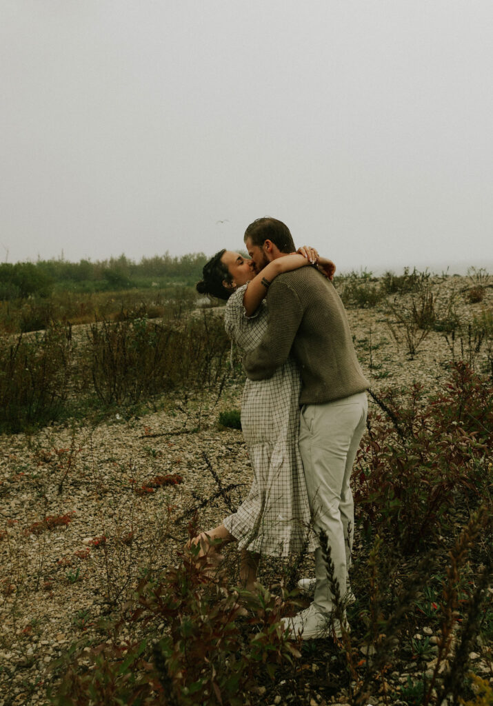 Couple getting engaged on Mackinac Island, Michigan taking couples pictures.