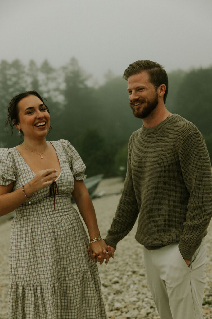 Couple getting engaged on Mackinac Island, Michigan on the beach.