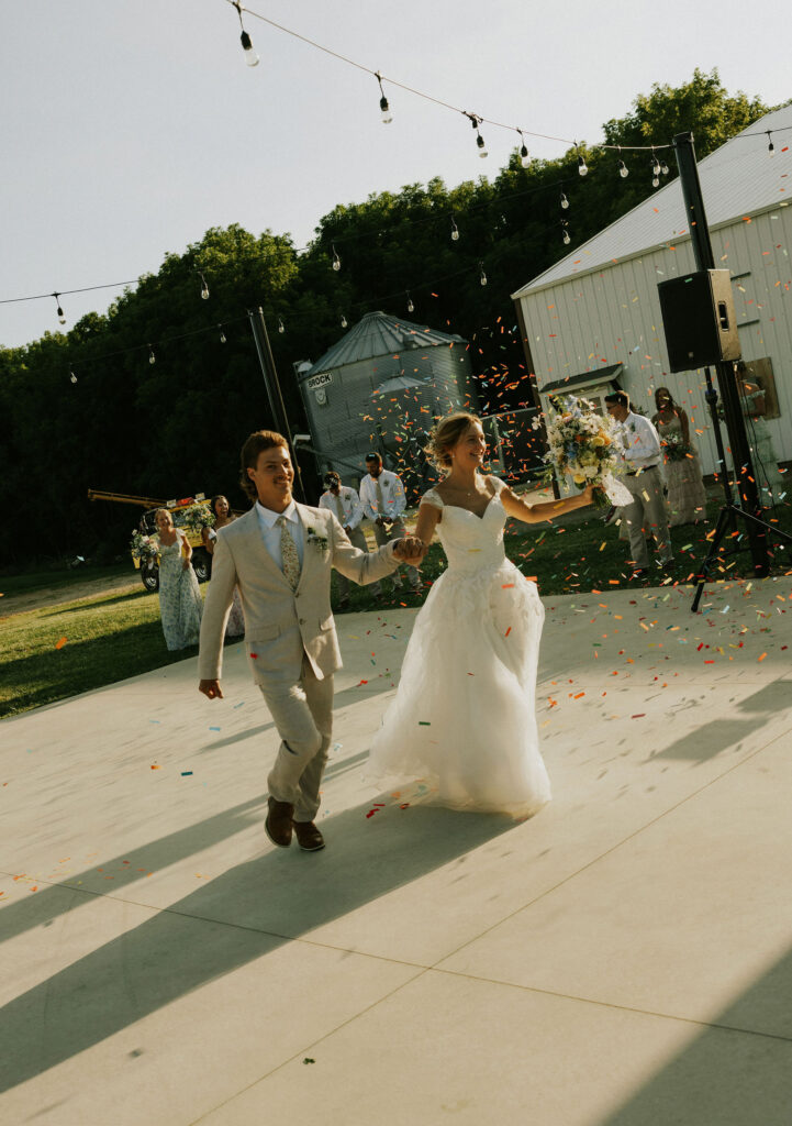 Bride and Groom enter the reception with confetti canons. 