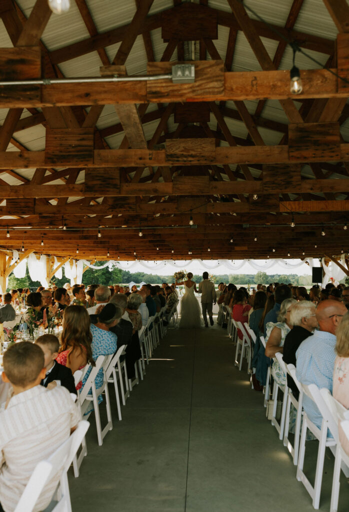 Bride and Groom enter the reception with confetti canons. 