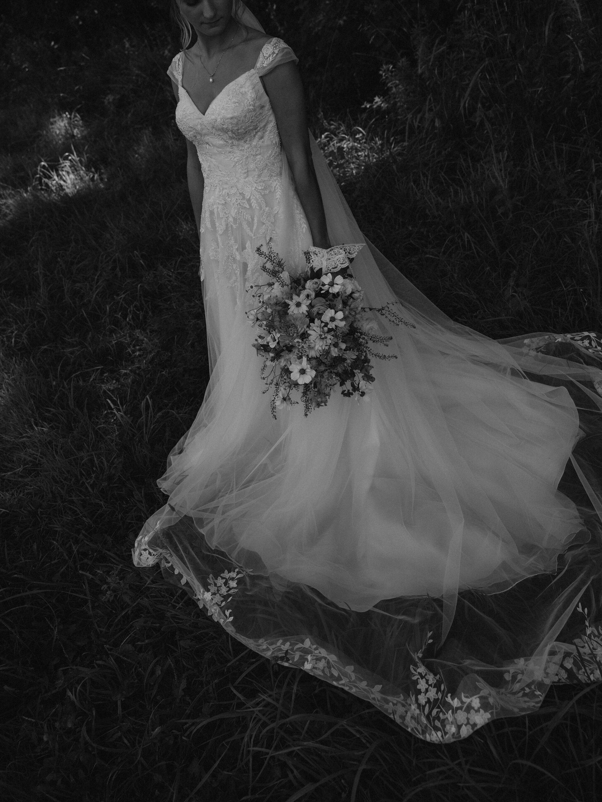 Bride portrait showing dress details and bouquet details.
